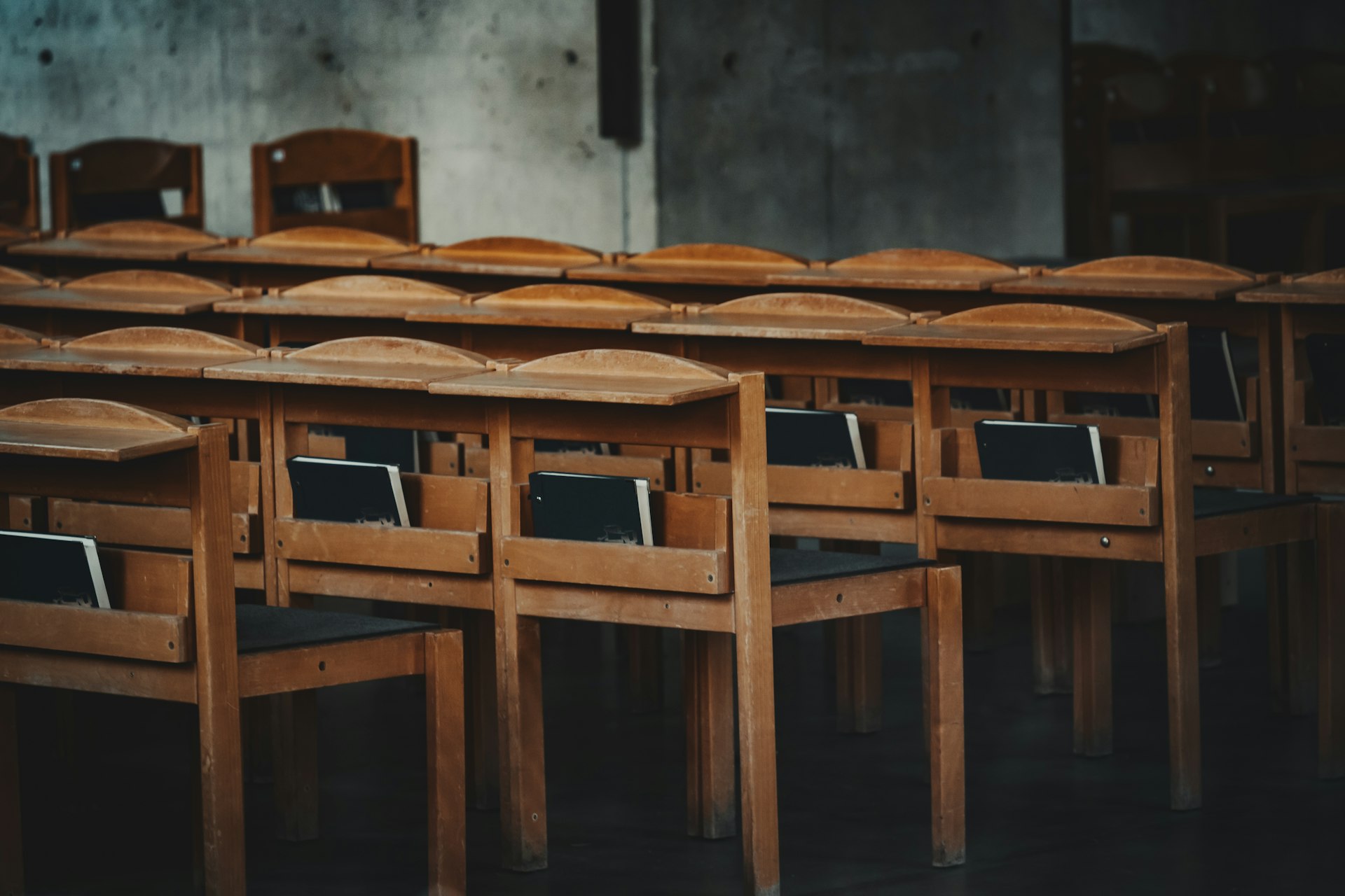 a room with wooden desks